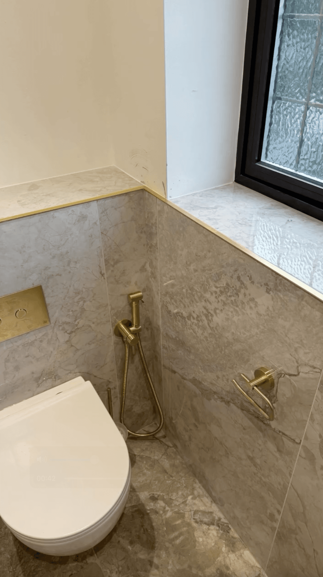 En-suite wetroom in Sprotbrough with bespoke basin and brushed brass details